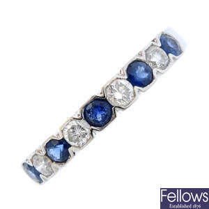 An 18ct gold diamond and sapphire half eternity ring.