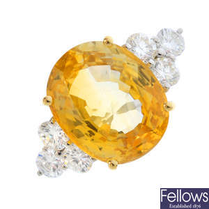 A yellow sapphire and diamond dress ring.