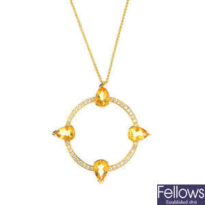 An 18ct gold citrine and diamond compass pendant.