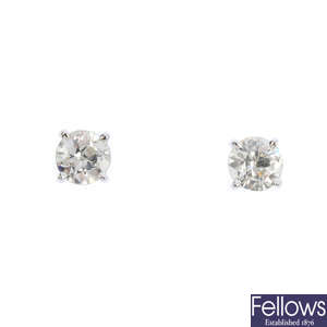 A pair of 18ct gold circular-cut diamond single-stone stud earrings.