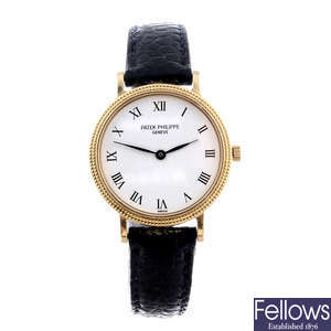 PATEK PHILIPPE - a lady's 18ct yellow gold Calatrava wrist watch.