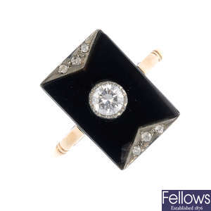 A diamond and onyx dress ring.