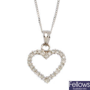 An 18ct gold diamond heart pendant, with chain.