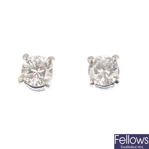 A pair of platinum brilliant-cut diamond stud earrings.