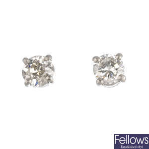 A pair of platinum brilliant-cut diamond stud earrings.