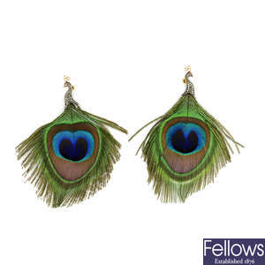 A pair of peacock feather and diamond earrings.