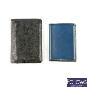 Two designer wallets.