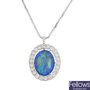 A boulder opal and diamond pendant, with chain.