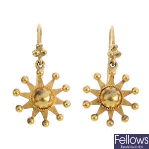 A pair of early 20th century gold earrings.