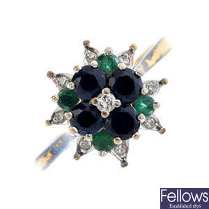 A sapphire, emerald and diamond ring.