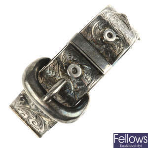 A late Victorian silver hinged buckle bangle.