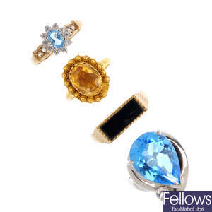 Four gem-set rings.