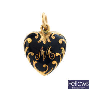 A mid Victorian gold enamel heart locket.