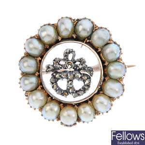 A mid Victorian gold, diamond, rock crystal and split pearl sentimental brooch.