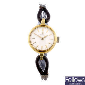 OMEGA - a lady's yellow metal wrist watch with Tudor bracelet watch.