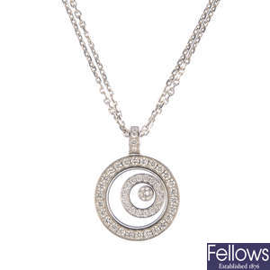 CHOPARD - an 18ct gold 'Happy Spirit' diamond pendant, with chain.