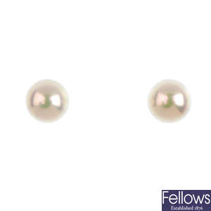 MIKIMOTO - a pair of cultured pearl stud earrings.