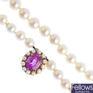 A cultured pearl two-row necklace, with synthetic ruby and split pearl clasp.