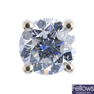 A single brilliant-cut diamond stud earring.