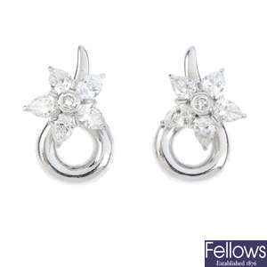 GARRARD - a pair of 18ct gold diamond star earrings.