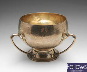 An Edwardian Art Nouveau planished silver bowl.