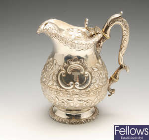 A George IV silver lidded water or beer jug.