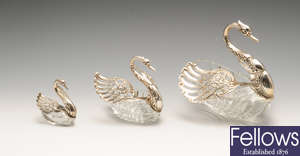 A matched set of three graduated import silver & glass swan dishes.