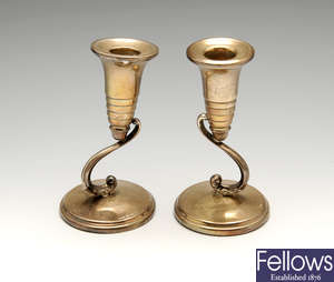 A matched pair of mid-20th century small silver candlesticks.