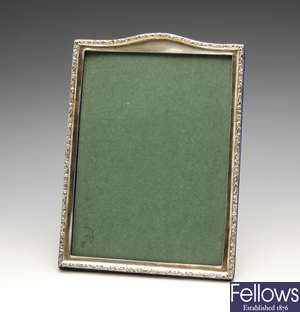 Three silver mounted photograph frames.