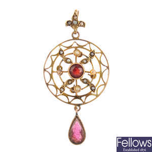 An early 20th century garnet and split pearl pendant.