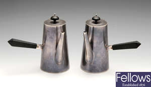 A pair of Edwardian silver chocolate pots.