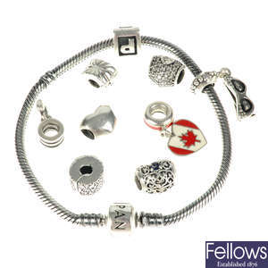 PANDORA - two charm bracelets and a total of eighteen charms.