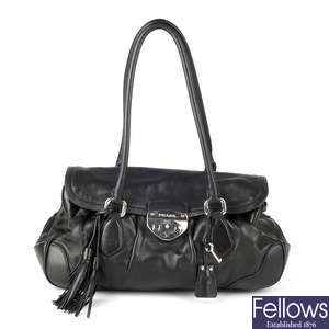 PRADA - a black leather Pushlock Tassel Flap handbag.