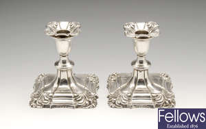 A pair of early twentieth century squat silver mounted candlesticks.