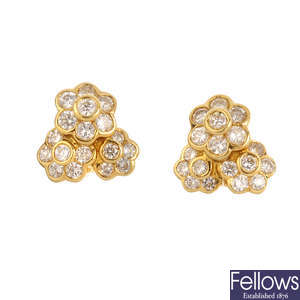 CLOGAU - a pair of diamond cluster earrings.