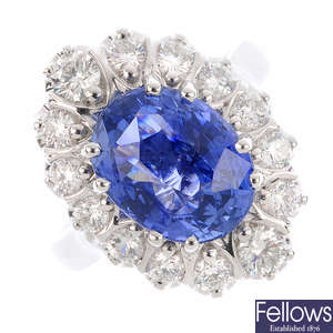 An 18ct gold Ceylon sapphire and diamond cluster ring.