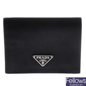 PRADA - a small black wallet.