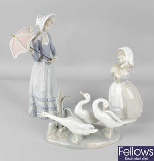Two Lladro figures and a Nao figure.