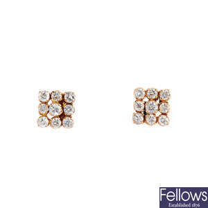 A pair of diamond cluster earrings. 