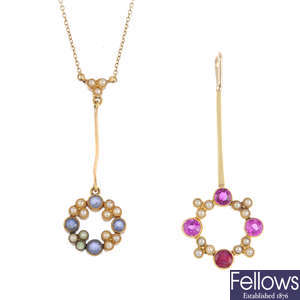 Two split pearl and gem-set pendants.