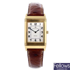 JAEGER-LECOULTRE - a yellow metal Reverso wrist watch.