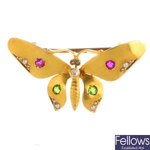 An Edwardian gold diamond and gem-set butterfly brooch.