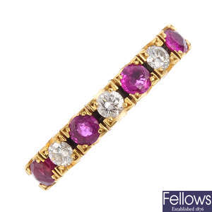 An 18ct gold ruby and diamond seven-stone ring.