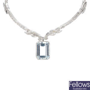 A diamond and aquamarine necklace.