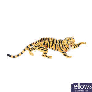 An 18ct gold diamond and enamel tiger brooch.