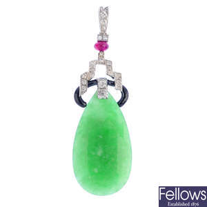 A jade, diamond and ruby pendant.