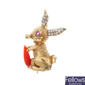 CARTIER - a mid 20th century diamond, ruby and coral rabbit brooch.