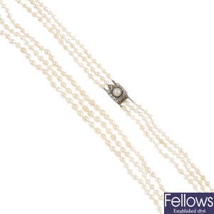 A natural pearl three-row necklace.