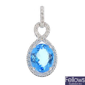 A blue topaz and diamond pendant.