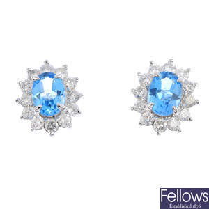 A pair of topaz and diamond cluster earrings.